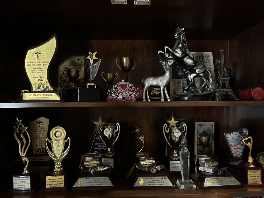A shelf of trophies from school